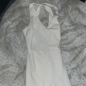 (M) All white criss cross body suit.